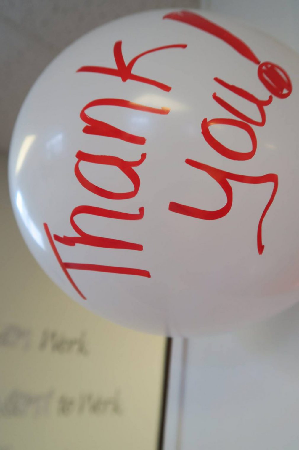 white balloon with "Thank You!" written in red