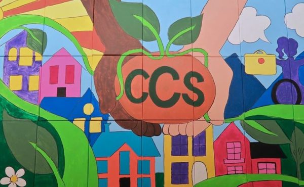 colorful, handcrafted mural featuring CCS and its work in the community